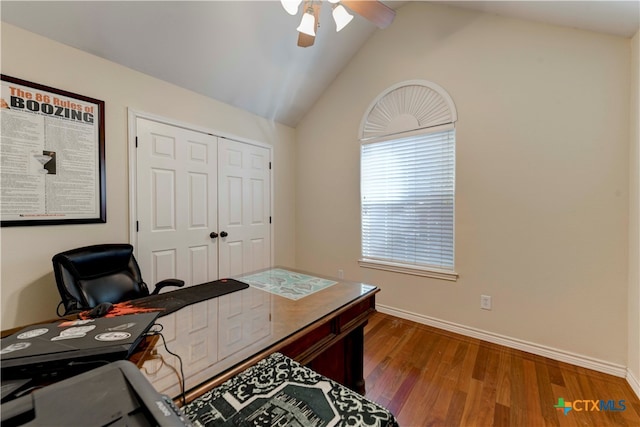 office featuring ceiling fan, wood-type flooring, and vaulted ceiling