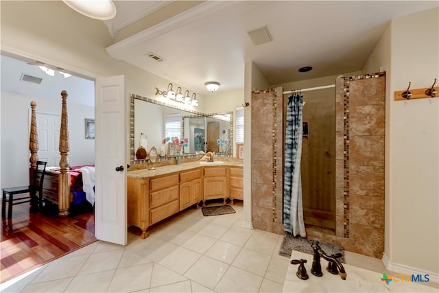 bathroom featuring wood-type flooring, vanity, curtained shower, and ornamental molding