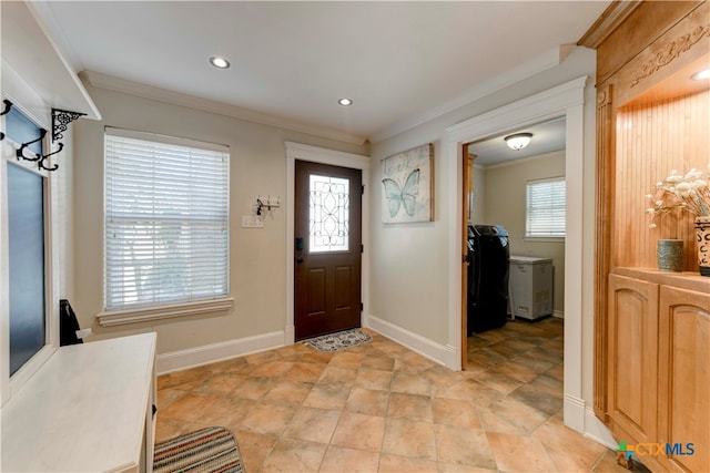 entryway featuring plenty of natural light and ornamental molding