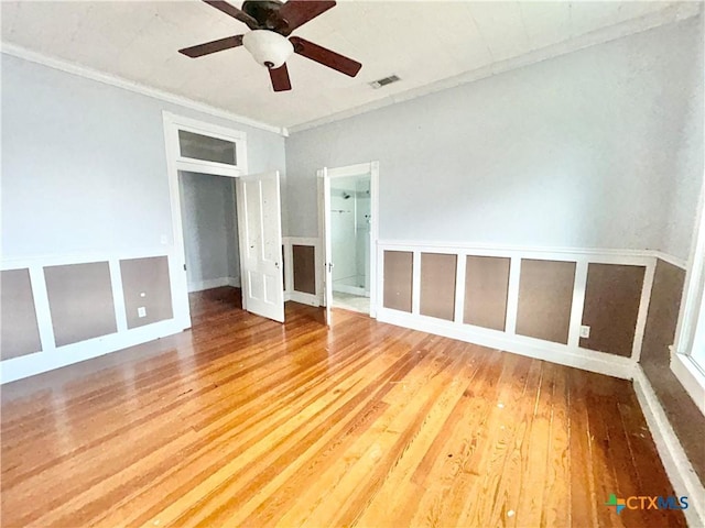 502 E Live Oak St, Cuero, TX 77954 - empty room with hardwood / wood-style floors, ceiling fan, and ornamental molding