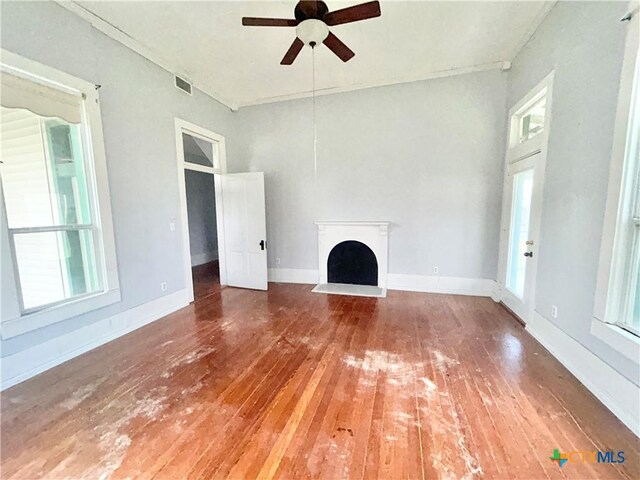 502 E Live Oak St, Cuero, TX 77954 - unfurnished living room with hardwood / wood-style flooring and ceiling fan