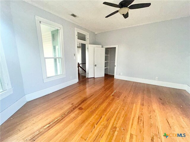 502 E Live Oak St, Cuero, TX 77954 - empty room featuring ceiling fan and wood-type flooring