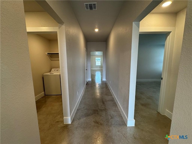 corridor with washer / clothes dryer