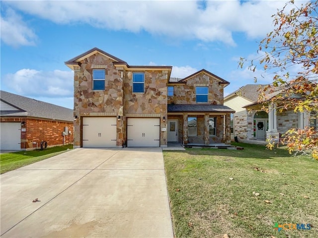 view of front of house featuring a front yard and a garage