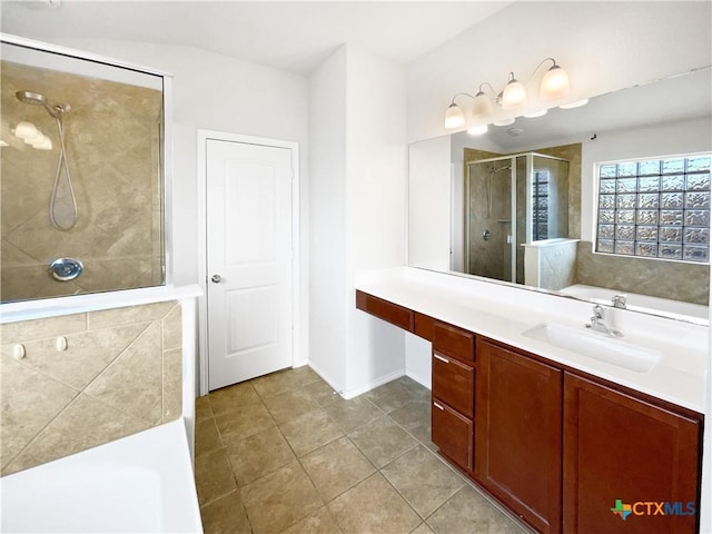 bathroom featuring tile patterned floors, vanity, and an enclosed shower