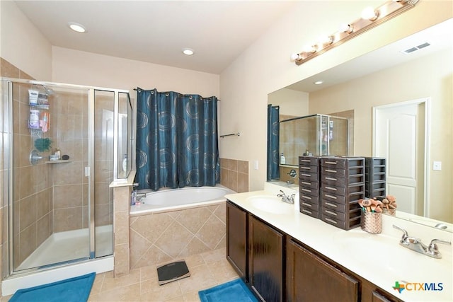 bathroom featuring tile patterned floors, plus walk in shower, and vanity