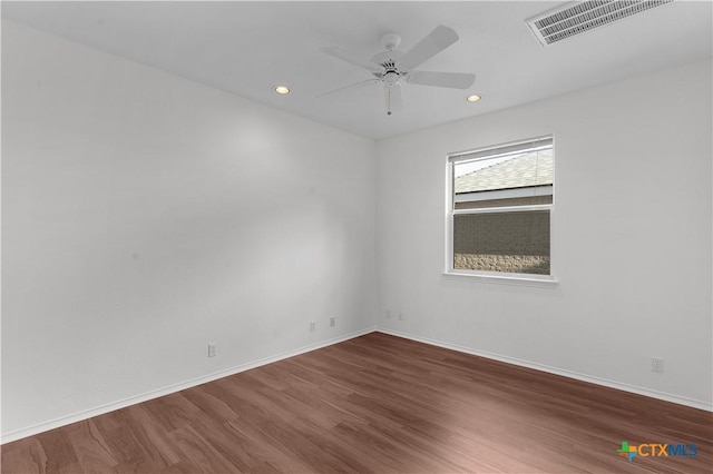 spare room featuring ceiling fan and wood-type flooring