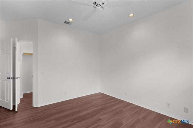 unfurnished room with dark hardwood / wood-style floors and ceiling fan