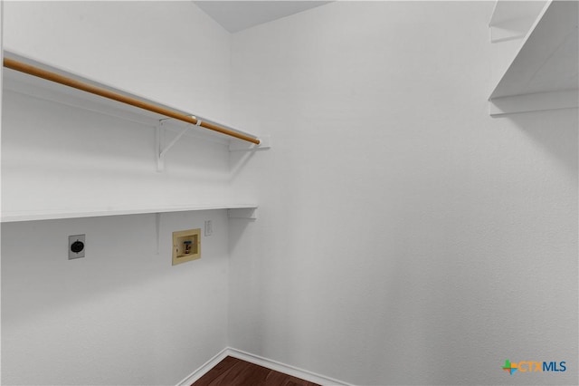 laundry room with hookup for a washing machine, dark wood-type flooring, and hookup for an electric dryer