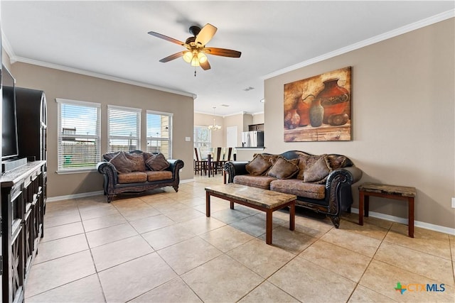 living room featuring baseboards, ornamental molding, light tile patterned floors, and ceiling fan with notable chandelier