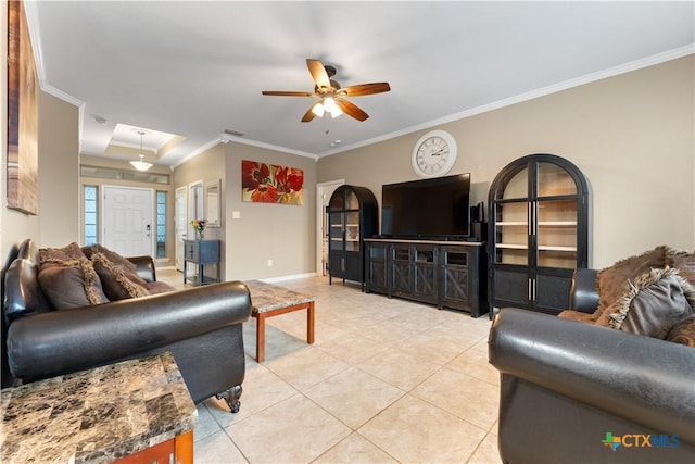 living room featuring ceiling fan, visible vents, light tile patterned floors, baseboards, and ornamental molding