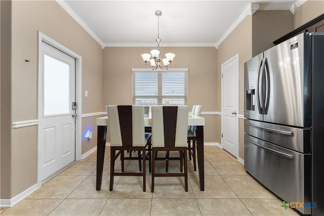 dining room featuring crown molding, light tile patterned floors, baseboards, and a notable chandelier