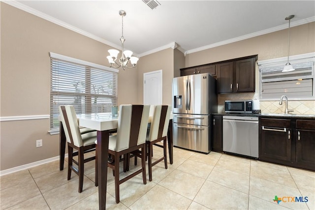 dining area with visible vents, crown molding, light tile patterned floors, baseboards, and a notable chandelier