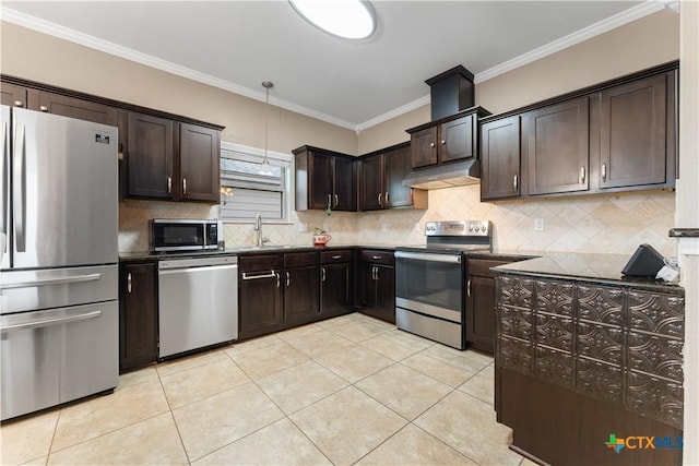 kitchen with dark brown cabinets, dark countertops, stainless steel appliances, light tile patterned floors, and ornamental molding