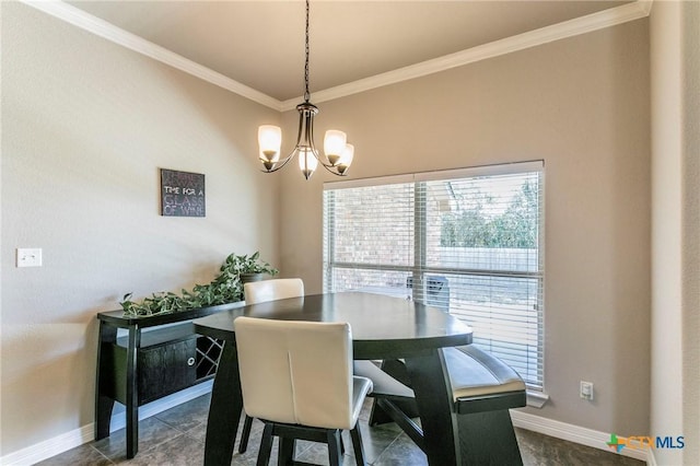 dining room featuring a notable chandelier, baseboards, and ornamental molding