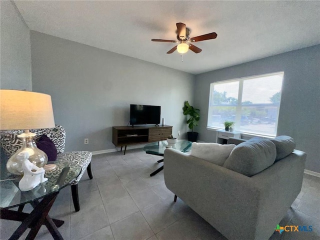 2918 Antelope Trl, Temple, TX 76504 - living room featuring light tile patterned flooring and ceiling fan