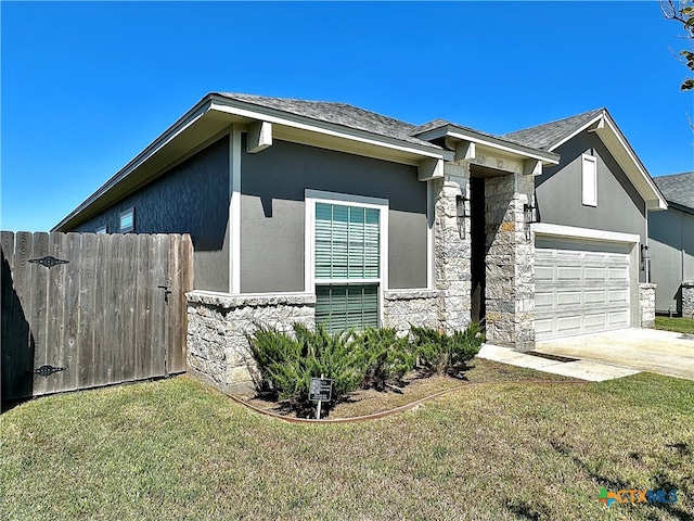 view of home's exterior with a garage and a lawn