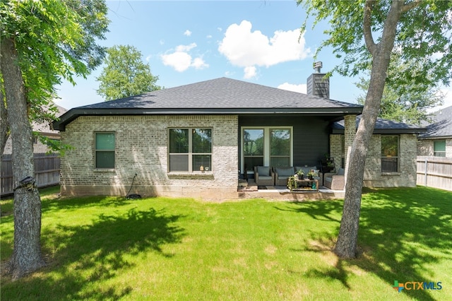 2823 Pistoia Trl, Temple, TX 76502 - back of property with an outdoor hangout area, a chimney, brick siding, a shingled roof, and a patio