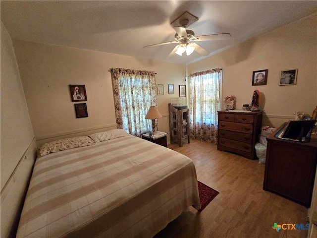bedroom with ceiling fan and light wood finished floors