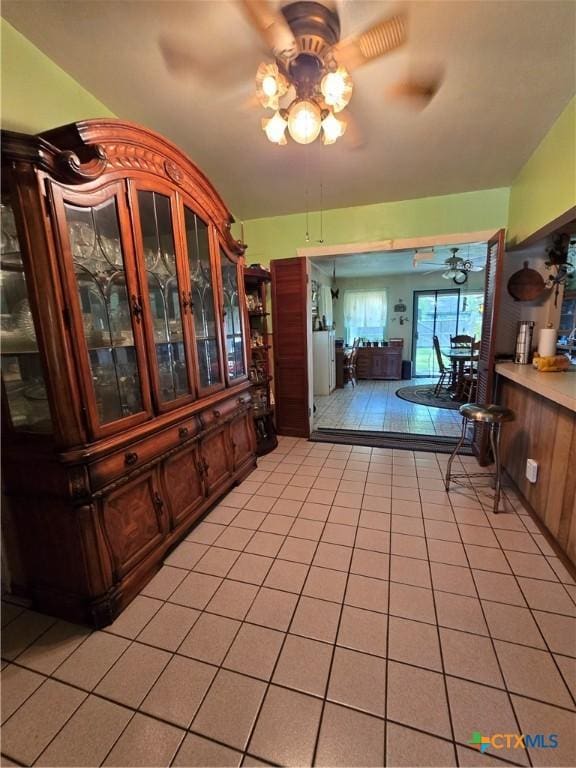 corridor with light tile patterned flooring