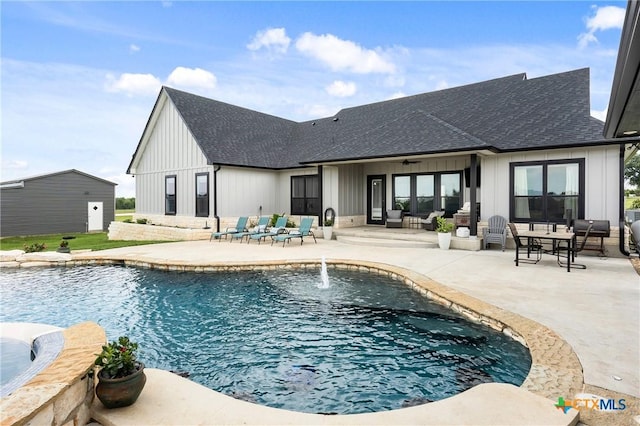 view of swimming pool featuring a patio, a ceiling fan, and an outdoor living space