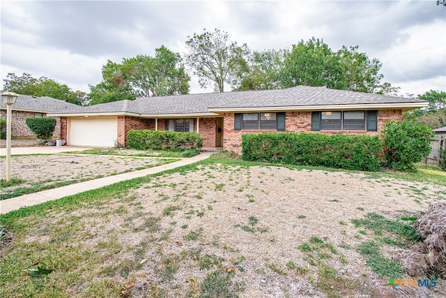 ranch-style home with a garage