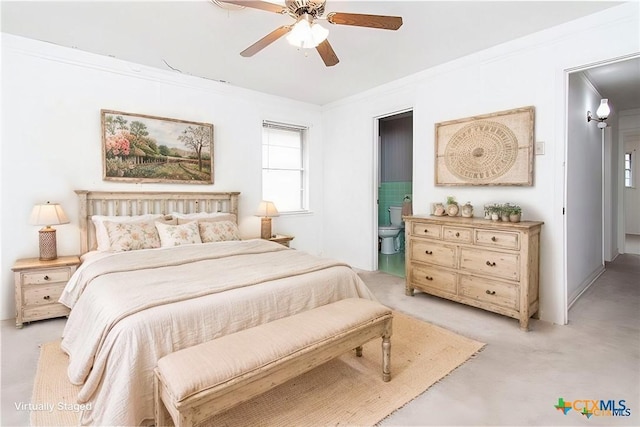 carpeted bedroom with ensuite bathroom, ceiling fan, and crown molding