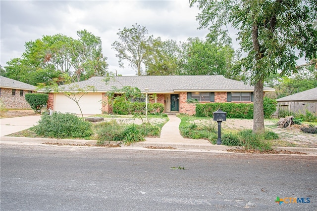 ranch-style home with a garage