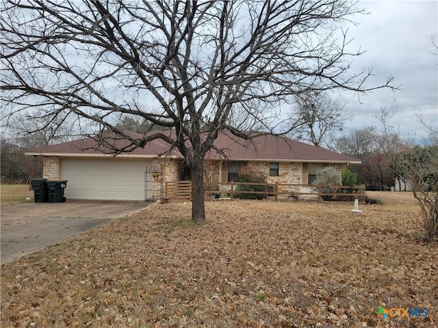 single story home with a garage