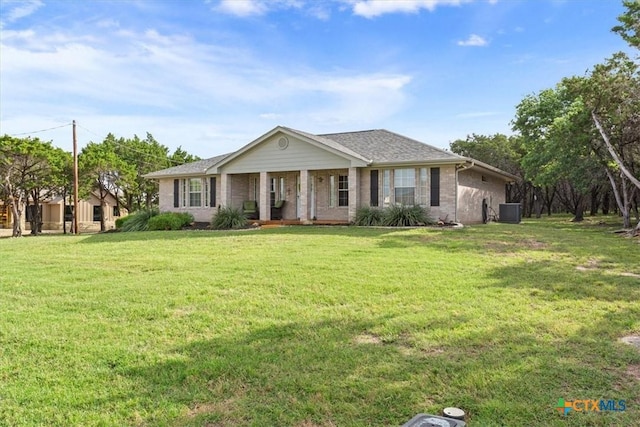 15938 Goliad Loop, Temple, TX 76502 - single story home with covered porch, a front lawn, and brick siding