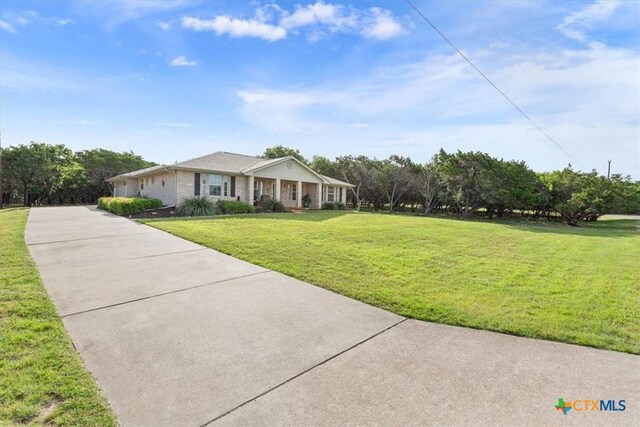 15938 Goliad Loop, Temple, TX 76502 - ranch-style house featuring driveway and a front yard