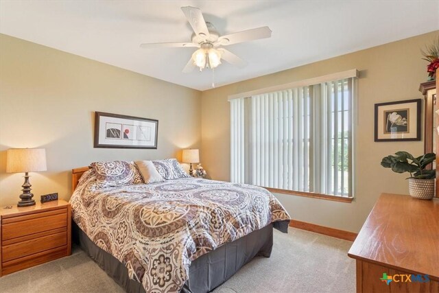 15938 Goliad Loop, Temple, TX 76502 - bedroom with light colored carpet, multiple windows, and ceiling fan