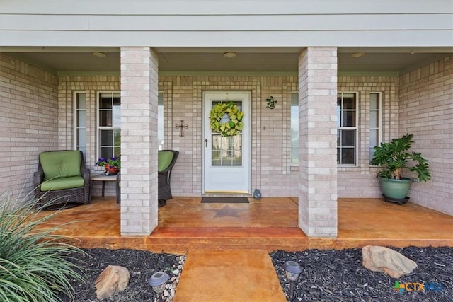 15938 Goliad Loop, Temple, TX 76502 - entrance to property featuring covered porch and brick siding