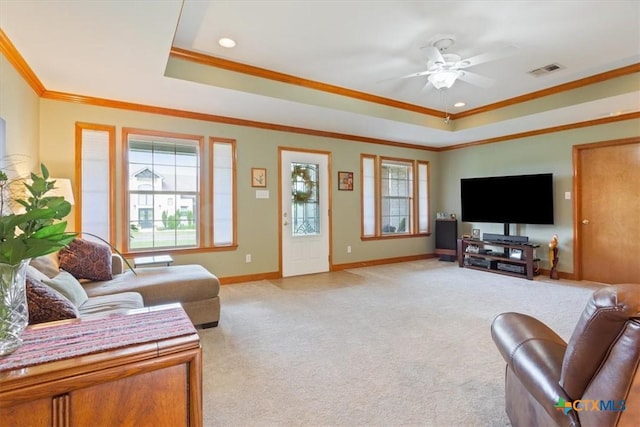 15938 Goliad Loop, Temple, TX 76502 - living area featuring a tray ceiling, crown molding, light carpet, ceiling fan, and recessed lighting
