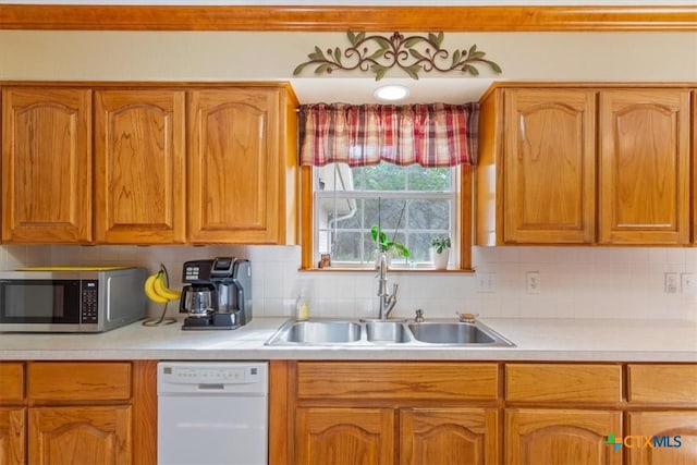 15938 Goliad Loop, Temple, TX 76502 - kitchen with white dishwasher, stainless steel microwave, light countertops, and tasteful backsplash