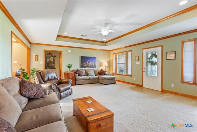 15938 Goliad Loop, Temple, TX 76502 - living room featuring crown molding, a tray ceiling, a ceiling fan, light carpet, and recessed lighting