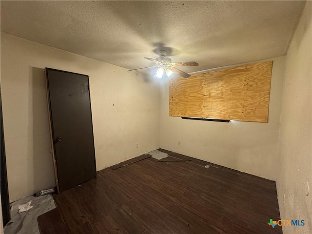 2103 Dickens Dr, Killeen, TX 76543 - empty room featuring ceiling fan, dark wood finished floors, and a textured ceiling