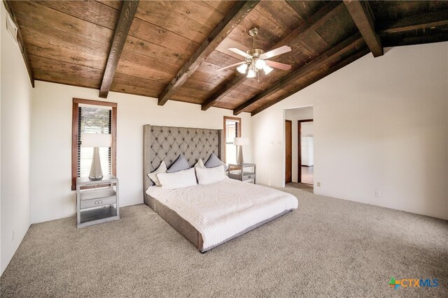 unfurnished bedroom with vaulted ceiling with beams, ceiling fan, carpet floors, and wood ceiling