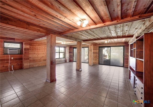 empty room featuring wood walls, tile patterned flooring, cooling unit, and wooden ceiling