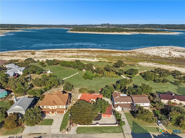 aerial view with a water view and a beach view