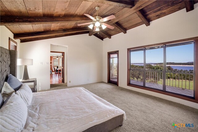 bedroom featuring carpet, ceiling fan, lofted ceiling with beams, a water view, and wooden ceiling