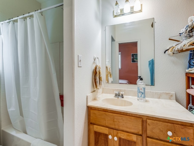 bathroom with vanity and shower / tub combo