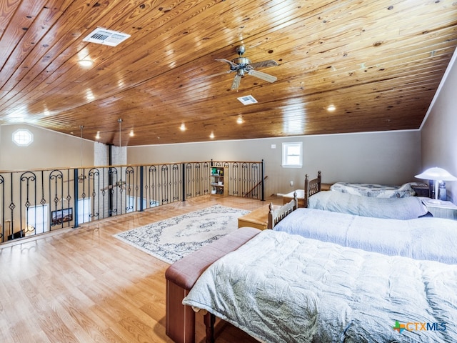 bedroom featuring wood ceiling, lofted ceiling, and light hardwood / wood-style floors