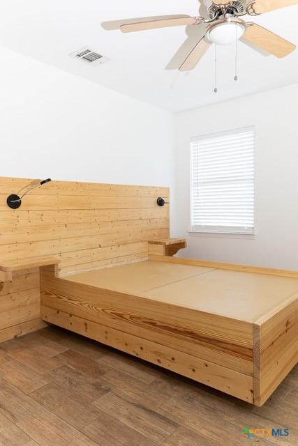 sauna / steam room featuring wood finished floors