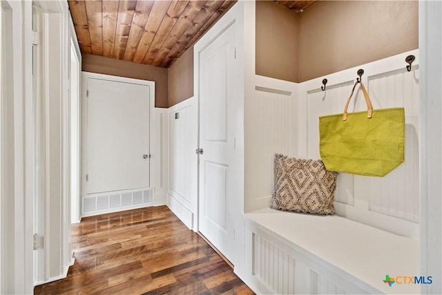 mudroom with wood ceiling, wood finished floors, and visible vents