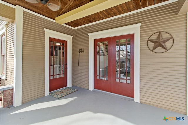 entrance to property featuring a ceiling fan and french doors