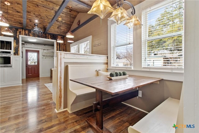 dining room with breakfast area, a wealth of natural light, and wood ceiling