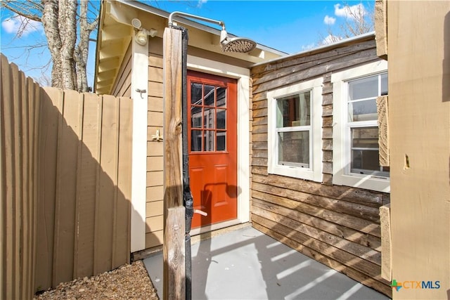 property entrance with fence