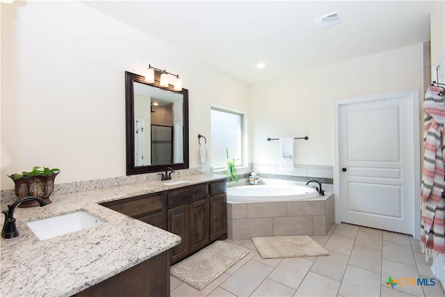 1729 Yturria Dr, Belton, TX 76513 - bathroom with tile patterned floors, a garden tub, vanity, and recessed lighting