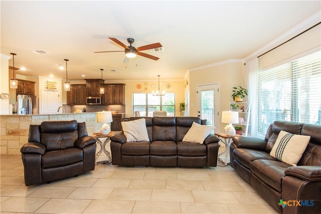 1729 Yturria Dr, Belton, TX 76513 - living room featuring ceiling fan, a chandelier, light tile patterned floors, and crown molding